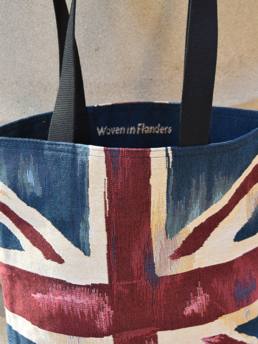 Tote bag with Union Jack design and 'Woven in Flanders' branding.